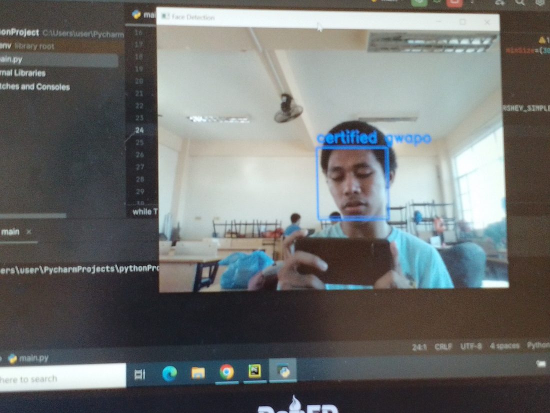 OpenCV face detection running in PyCharm: a blue bounding box tracking a face on the webcam feed, labelled “certified gwapo”.